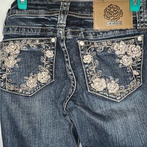 LA Idol Boot Cut Jeans. Flower Bling Back Pockets.
